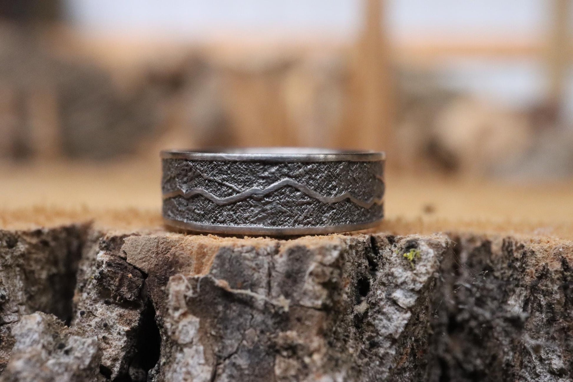 Handcrafted titanium ring with a rugged mountain range design, inspired by the Rockies. 'The Rocky Ridge' symbolizes strength and adventure, perfect for outdoor enthusiasts. A unique statement piece for those who love nature and the great outdoors.