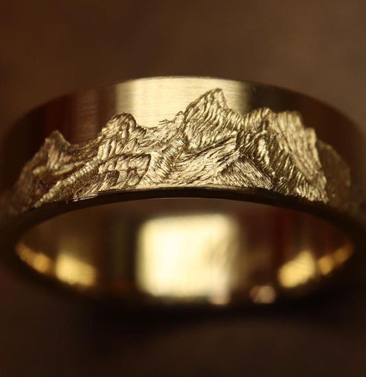 Grand teton mountain range, hand carved on to 14k Yellow gold ring. 6mm wide with comfort fit profile